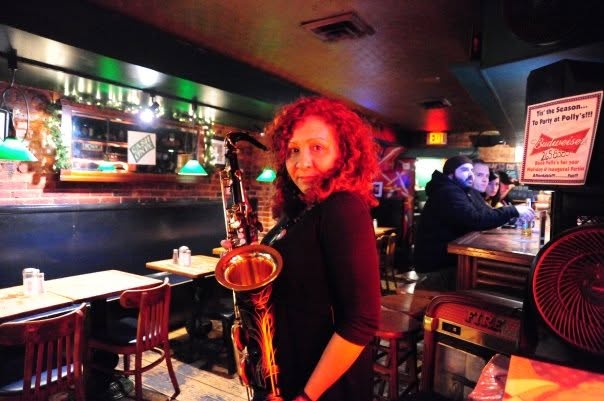 Rita Ferreira with tenor saxophone